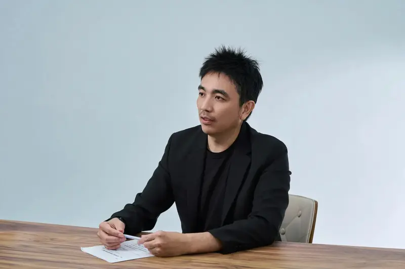 Tiger Lee seated in an interview setting